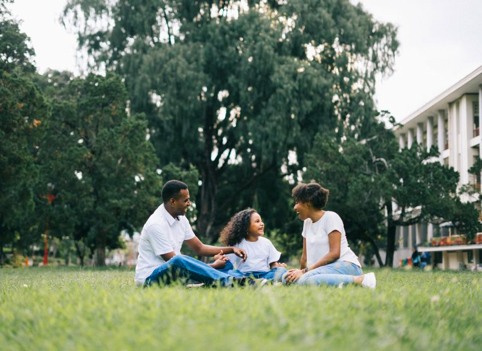 Family of three sat in park