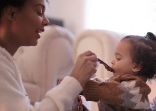 Woman feeding her child