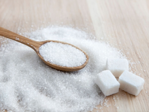 Pile of sugar and spoon
