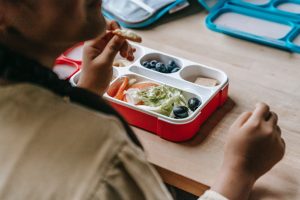 Child eating from healthy lunchbox