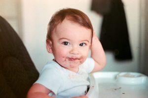 Baby with food around mouth